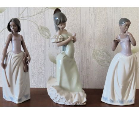 Three various Nao glazed ceramic figures. Largest Approx. 30cms

reasonable used condition 