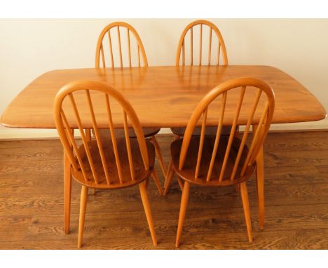 Ercol mid 20th century refectory style dining table with four stick back chairs. Table Approx. 72cm H x 151cm W x 77cm D Reas