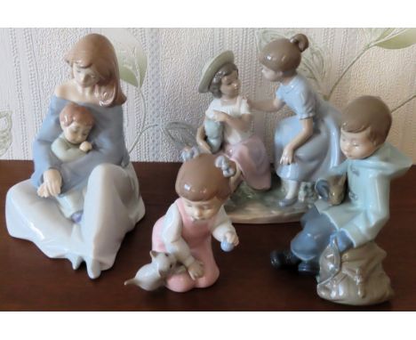 Four various Nao glazed ceramic figure groups

all reasonable used condition 