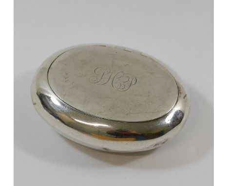 A George V oval silver squeeze snuff box, Sheffield 1910, by Walker and Hall, of plain design, the lid engraved with scrollin