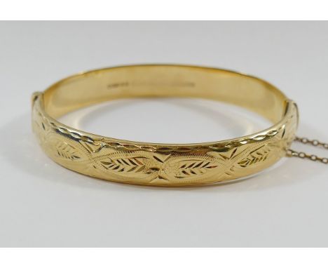 A nine carat gold hollow hinged bangle, Birmingham 1992, 12.6g gross CONDITION REPORT: If you require further images of this 