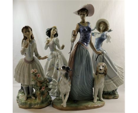 Four Lladro figures of ladies, the tallest walking two dogs, 38cm high CONDITION REPORT: Lady walking dogs - Glue residue ben