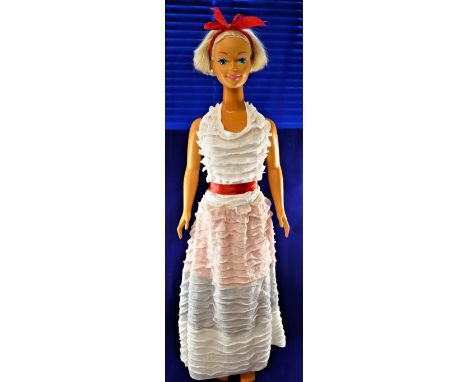 A large Mattell shop display Barbie doll, with moving limbs, sprayed on underwear and short bobbed blonde hair, marked 'Matte