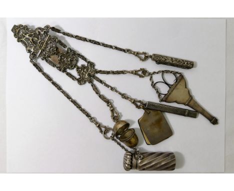 A Victorian silver plated chatalaine, ornately cast with classical figures, with five chains of floral cast links, suspended 