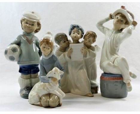 Four Lladro porcelain figures and figural groups, the tallest of a boy with a football, 21cm high, a group of angels, a boy w