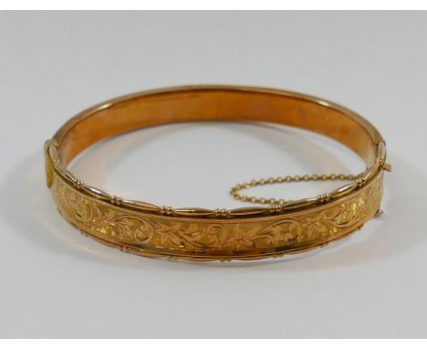 A 9 carat rose gold hollow hinged bangle, Birmingham 1914, 11g CONDITION REPORT: If you require further images of this lot or