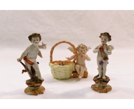 Two small 19th century porcelain figures of Cupid, one modelled holding a flaming heart, the other with bow, on scroll bases 