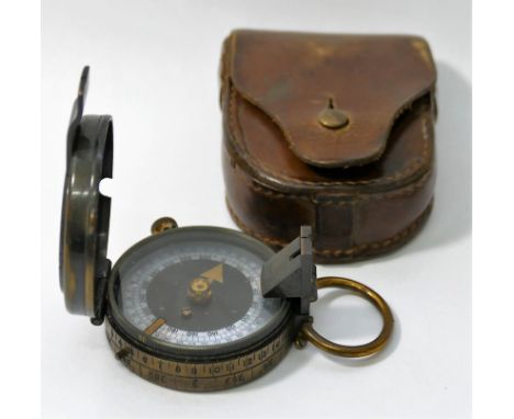 A Negretti and Zambra prismatic compass, with lacquered and brass case and mother of pearl dial, with leather case, glass bro