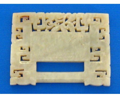 A Chinese pale celadon jade openwork plaque shaped as a lock, the border carved and pierced surrounded by confronting stylise