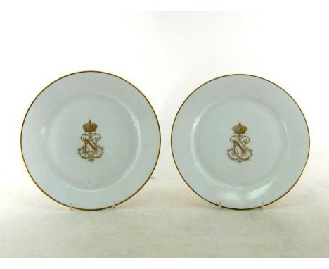 Napoleon III porcelain. A pair of French Sevres dinner plates, circa 1862, in white with gold rim, the centre with the crowne