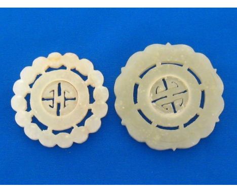 Two Chinese openwork jade plaques, one a white jade carved and pierced on both sides with adjoined circles of chrysanthemum s