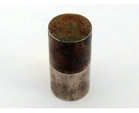 Sewing interest. An American silver cylindrical holder for a bobbin of cotton thread, a side slot and hole to allow the threa