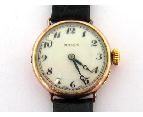 ROLEX, a 1920s 9 carat gold mid-size wristwatch, no. 23586, the three piece case Glasgow import marked, the white enamel dial