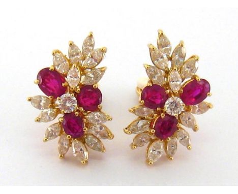 A pair of Italian ruby and diamond ear clips, each spray cluster set with central brilliant approx. 0.17 carat, in a surround