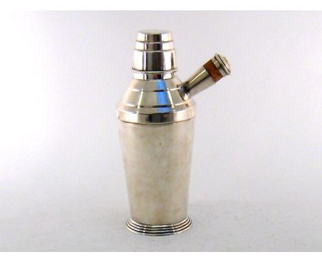 A one pint capacity silver-plated cocktail shaker by Maple & Co. of London, in the Art Deco style, 23 cm. high 