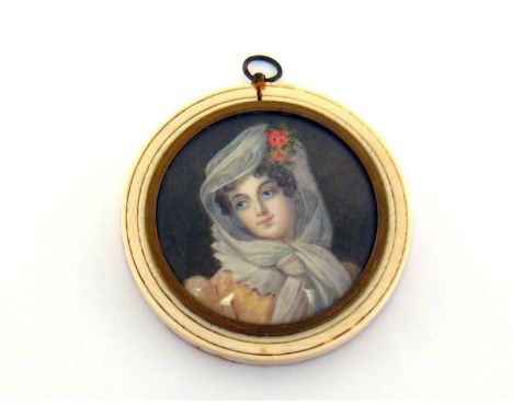 A 19th. century circular miniature on card of a lady in white head scarf , signed possibly “Martin”, in circular ivory frame.