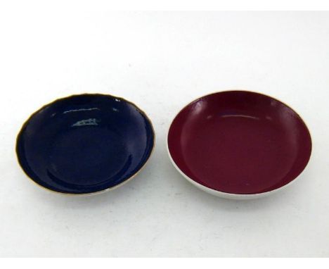 Two Chinese ceramic dishes, one ruby glazed, mark of Yongzheng, Qing period, the other aubergine glazed with gilt scalloped r