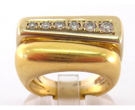 A French gentleman's diamond dress ring, the large rectangular bezel set with a line of graduated brilliants, totalling appro