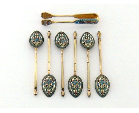A set six Russian silver-gilt and cloisonne enamel teaspoons and a similar pair of sugar tongs, maker's mark SK (Cyrillic), M