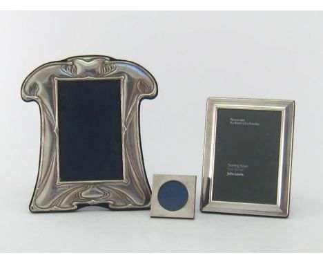 A silver-fronted photograph frame, mark of PJP, Birmingham, 1992, shaped rectangular, stamped with an Art Nouveau design, 21 