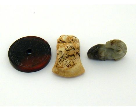 Three Chinese jade carvings in the Ming style, one brown jade plaque carved in “Bi” shaped with engraved Chi dragon pattern o
