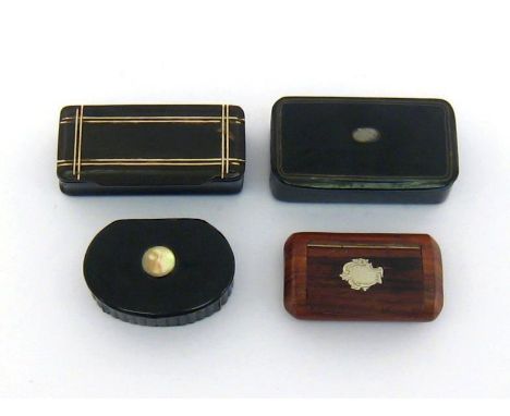 Four snuff boxes, comprising one in moulded horn with bone insets, an oval papier mache example with ribbed sides and m.o.p. 