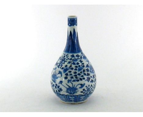 A Chinese blue and white gall- bladder shaped bottle, decorating lotus and birds on the body. Kangxi marks to the base, and Q