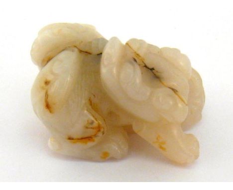 A Chinese white jade carving of mythical animals, a slice of brown skin on one back of mythical animal, 19th/20th century, 6c