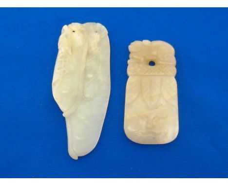 Two Chinese white jade pendants carved on each side, one in the form of two hanging bean pods, tendrils and leaves, denoting 