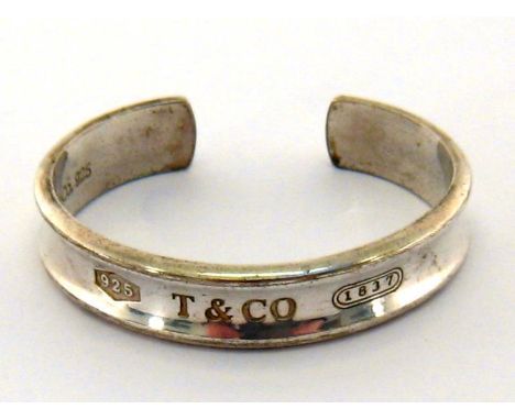 Tiffany & Co, a silver bangle, dated 1997, signed, 5.5cm inner diameter, 34.6gms 