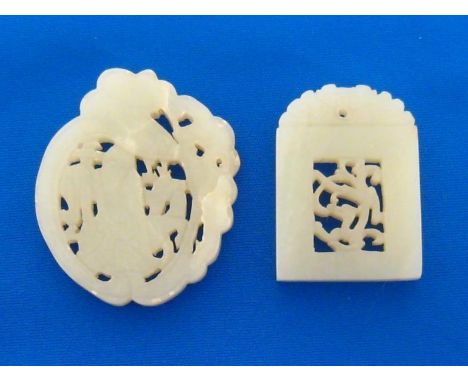 Two Chinese white jade plaques finely carved and pierced on both sides, the rectangular white jade plaque carved as a frame w