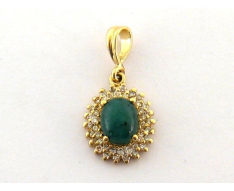 A nephrite and diamond pendant, the central oval cabochon in a two row surround of small brilliants, the bale stamped '14k', 
