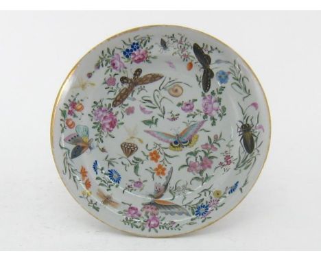 A Chinese ceramic famille-rose plate with gilt rim, finely decorated with flowers, insects and butterflies, Yongzheng period,