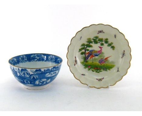 A 19th. century European ceramic dish with gilt scalloped rim, underglaze hand-decorated with pheasants in pasture, the borde