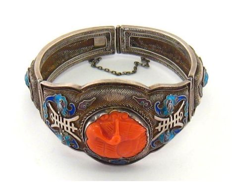 A Chinese enamel and coral bracelet, set to the centre with a carved coral disc modelled as a water bird in relief, the mesh 