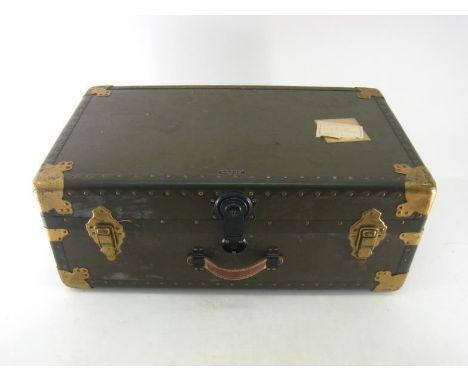 A large  ”Amelia Earhart” cabin trunk in olive drab with riveted and brassed steel mounts, ash runners, leather handles and “