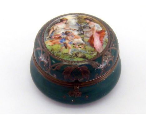 A 19th. century gilt green enamelled circular pot, the lid with enamelled scene of two young ladies playing blind man’s bluff