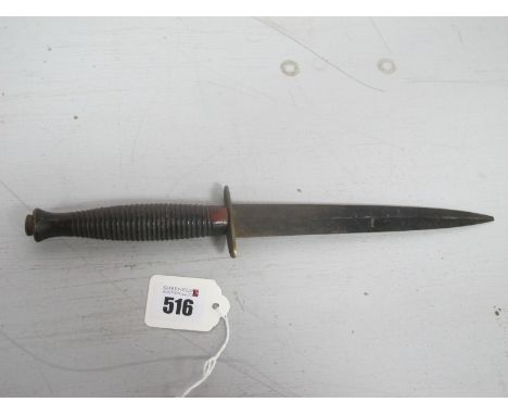 A British Army Fairbairn Sykes Commando Style Fighting Knife. (Buyer to fully satisfy themselves regarding authenticity).