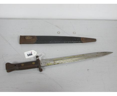 Boer War Era British Army Pattern 1888 Lee Metford Bayonet, with wood grips, spear type blade and leather scabbard, the ricas