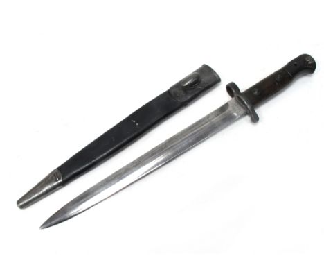 A British Army Pattern 1903 Sword Bayonet, with metal pommel, wood grips, muzzle ring and straight spear point blade. Regimen