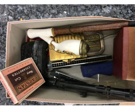 A box of odds: butterflies, pipe, opera glasses etc