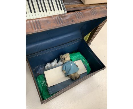 A tin trunk; together with vintage toys