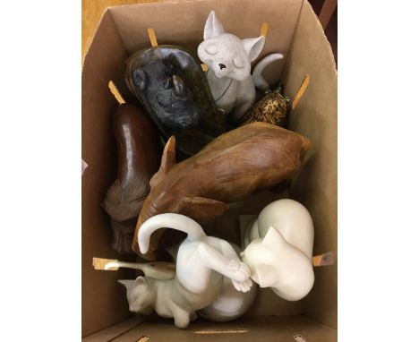 A box of carved and ceramic animals