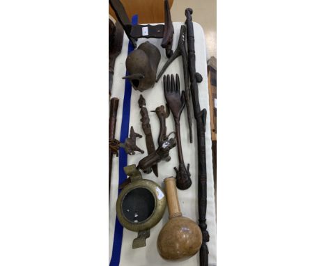 Tribal items to inc a carved stick, hand, bronze nutcracker etc