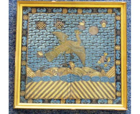 A gilt framed and glazed late 19th century Needlework from the back of a Mandarin's cloak, the open-winged fen above stylised