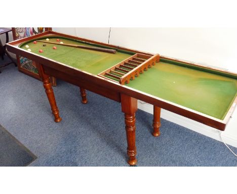 A 19th century mahogany Bagatelle Board, green velvet lined, ivory balls and makers plaque of Ayres of London, raised on maho