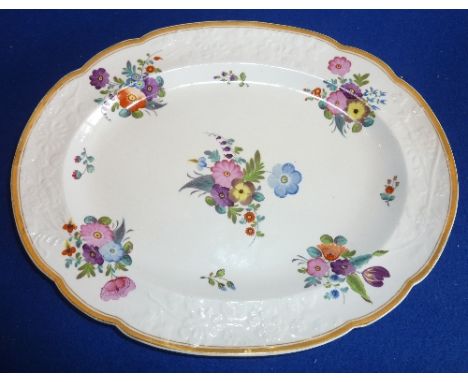 An early 19th century oval Spode porcelain Dish, the raised border decorated in relief with various flowers etc. and the gild