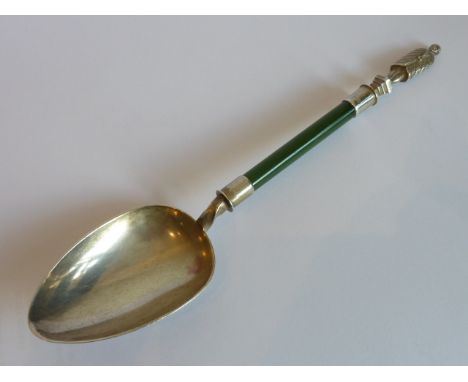 An unusual late 19th Century hallmarked silver Spoon, the finial very finely cast and engraved with a male figure standing up