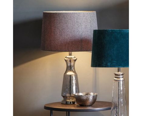 Lastrea Table Lamp With a beautifully textured glass base and metal highlights, this stunning table lamp is finished with a n