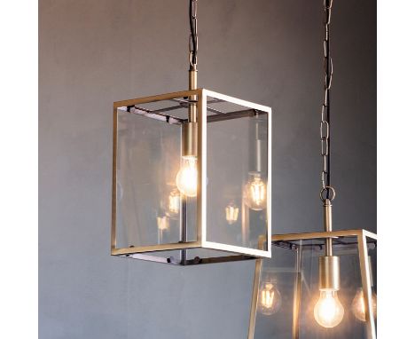 { Option of lots:  1215, 1216 } Wilton Pendant Light This clear glass pendant light has a cool silver finished frame.Steel / 